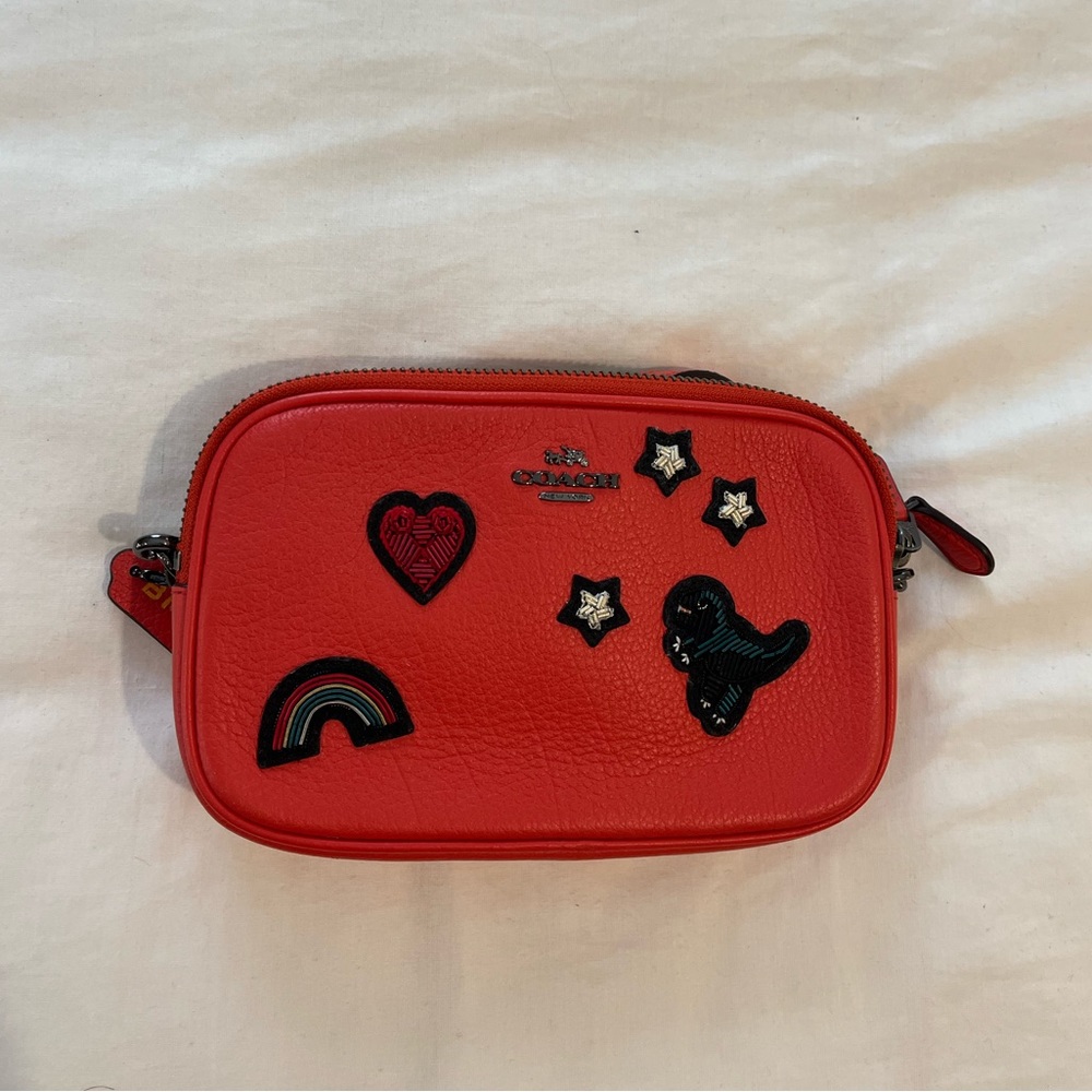 Red Coach crossbody purse with charms